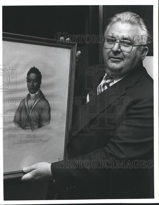 1980, David Vann holds portrait of "Daivid Vann, A Cherokee Chief" - Historic Images