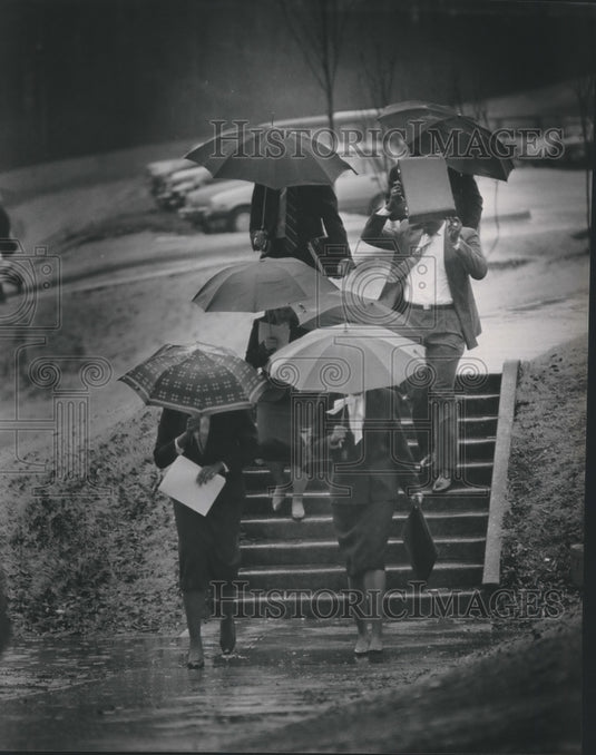 1987 Samford, Alabama Interviewers for Job Placement in Rain - Historic Images