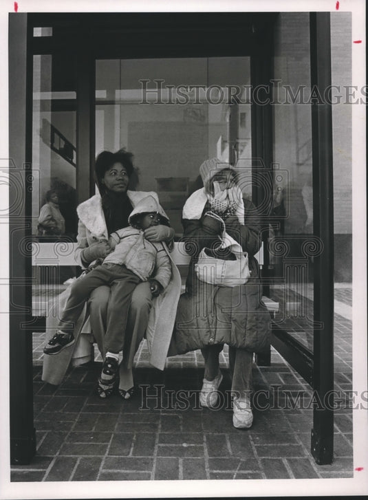 1987, Lola Stringer and grandson, Michael Stringer at Bus Enclosure - Historic Images