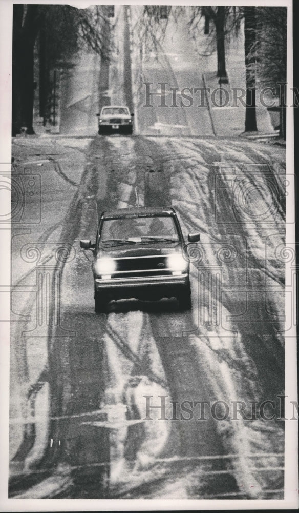 1988, Cars navigating Snow covered roads in Birmingham, Alabama - Historic Images