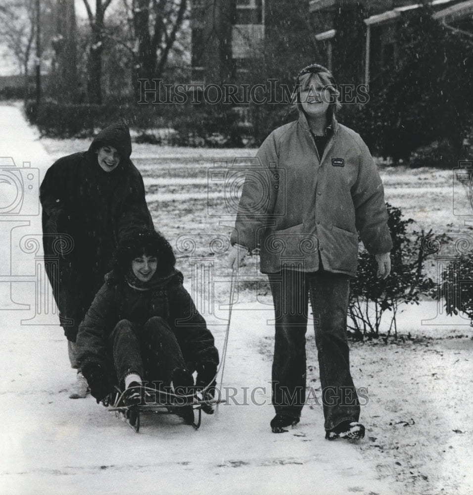 1982, Tom, Debbie and Nancy going sledding, Alabama - abna17562 - Historic Images