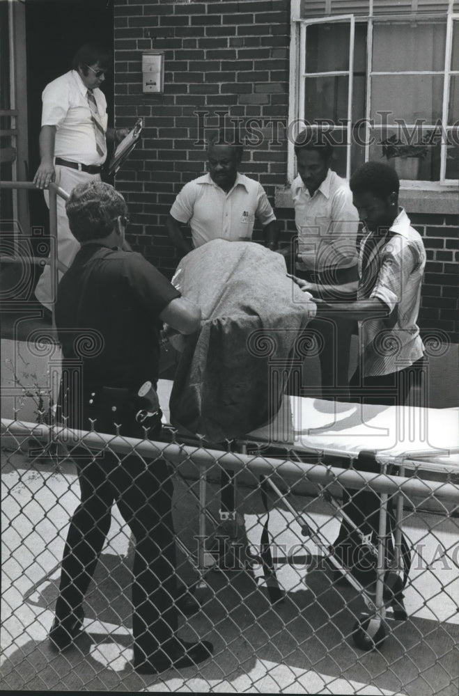 1980, Victim of Monday&#39;s heat carried from apartment, Alabama - Historic Images