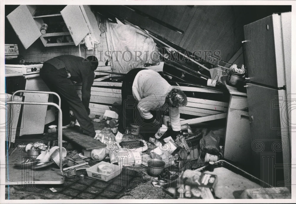 1989 Roderick Hollis and Cassandra Kindred clean up after Storm - Historic Images