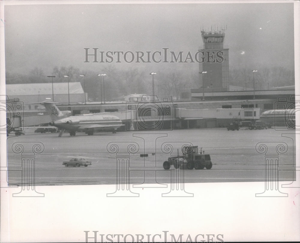 1988, Road Grader clears snow at airport runway - abna17640 - Historic Images