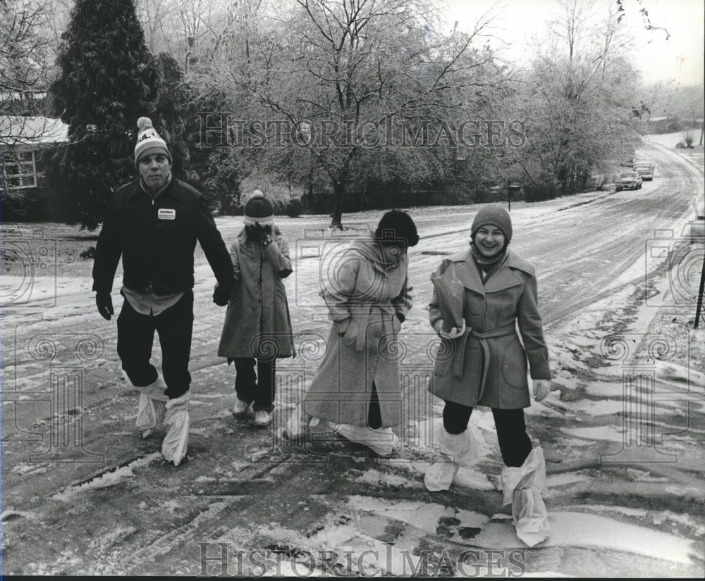 1982, Family walks on snowy Orchid Street in Roebuck Gardens. - Historic Images