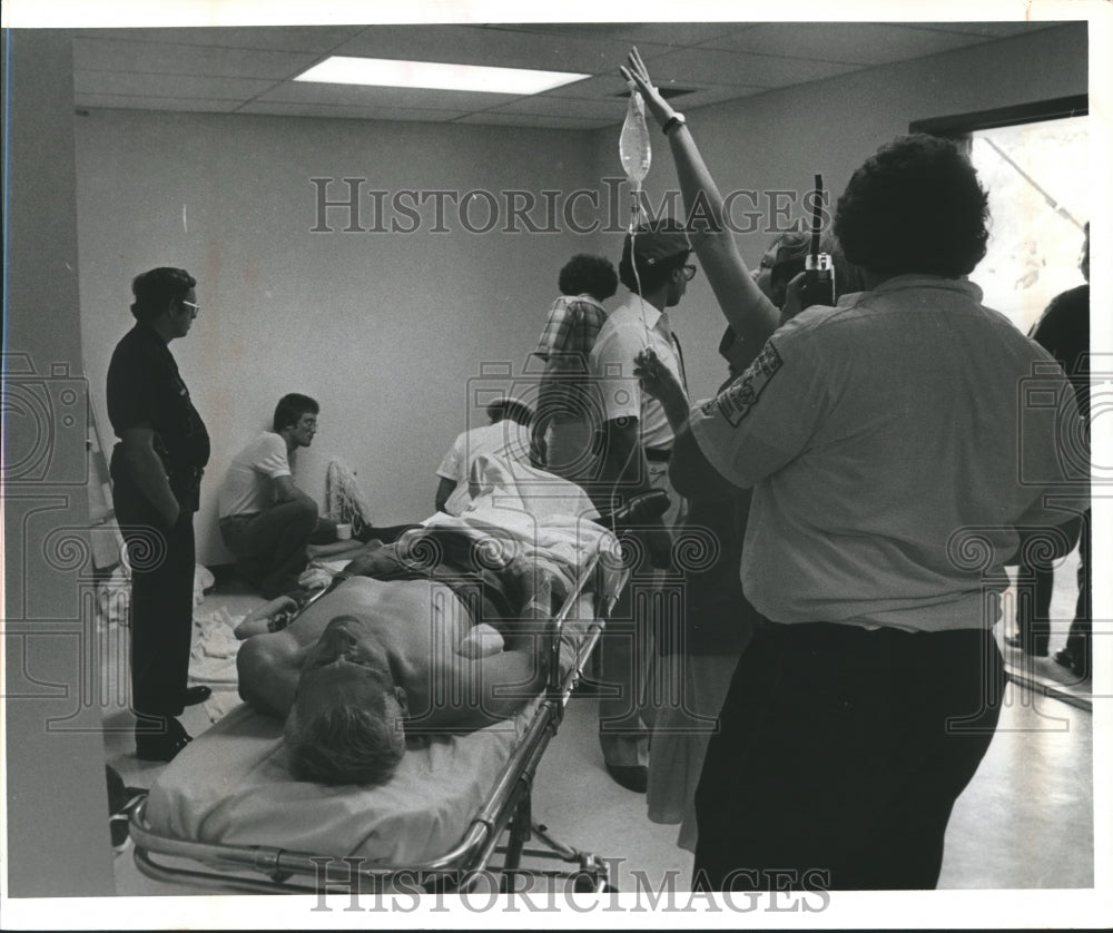 1980 Patients helped at Red Cross emergency stations at stadium - Historic Images