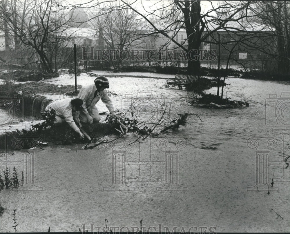 1980, Tactical squad clears drainage ditch after heavy rains, Alabama - Historic Images