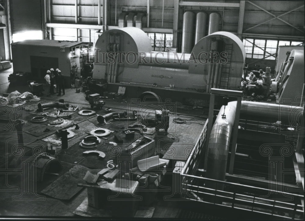 1977, Repairmen work at Wilsonville, Alabama Gaston Generating Plant - Historic Images