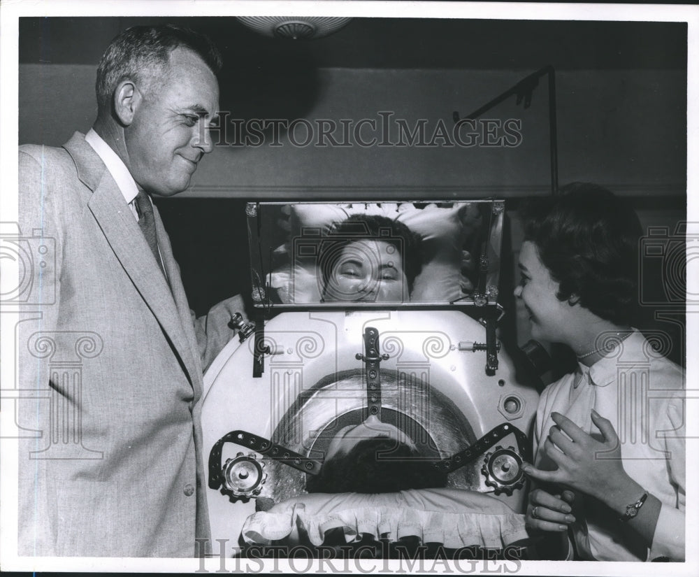 Lili Gentle talks to patient inside medical equipment-Historic Images