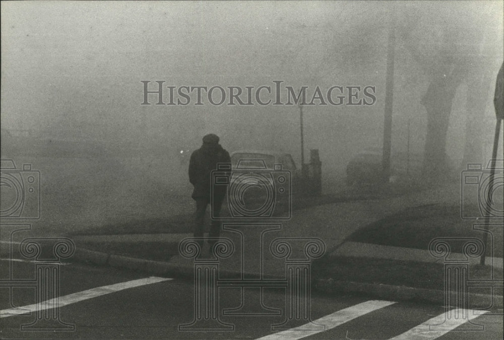 1979 Press Photo Unidentified man walks through the fog, Birmingham, Alabama - Historic Images