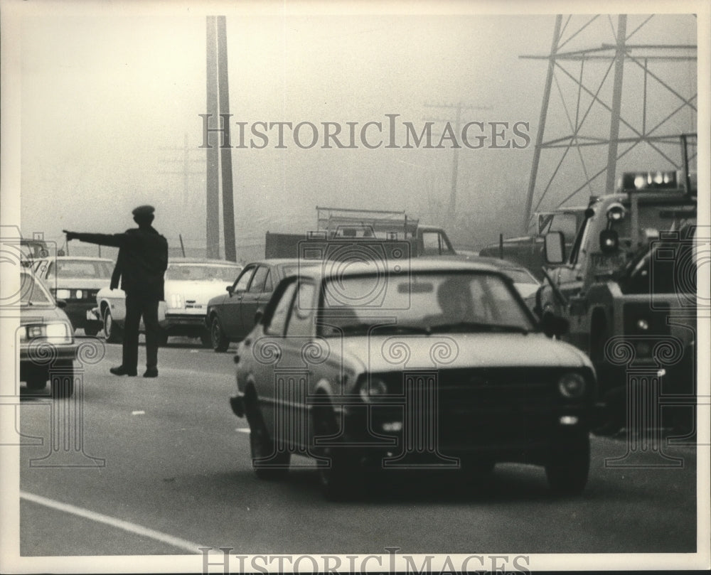 1985, Officer directs traffic at wreck on Green Springs Road, Alabama - Historic Images