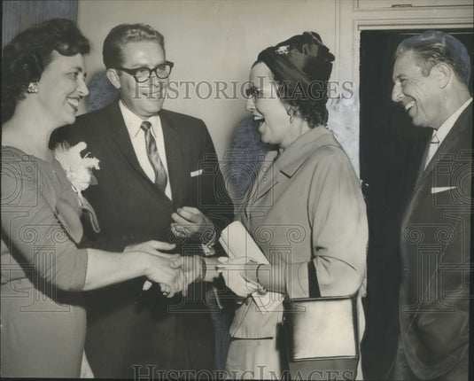 1960, Judson College President and Wife Greet Mr. & Mrs. G.C. Coggins - Historic Images