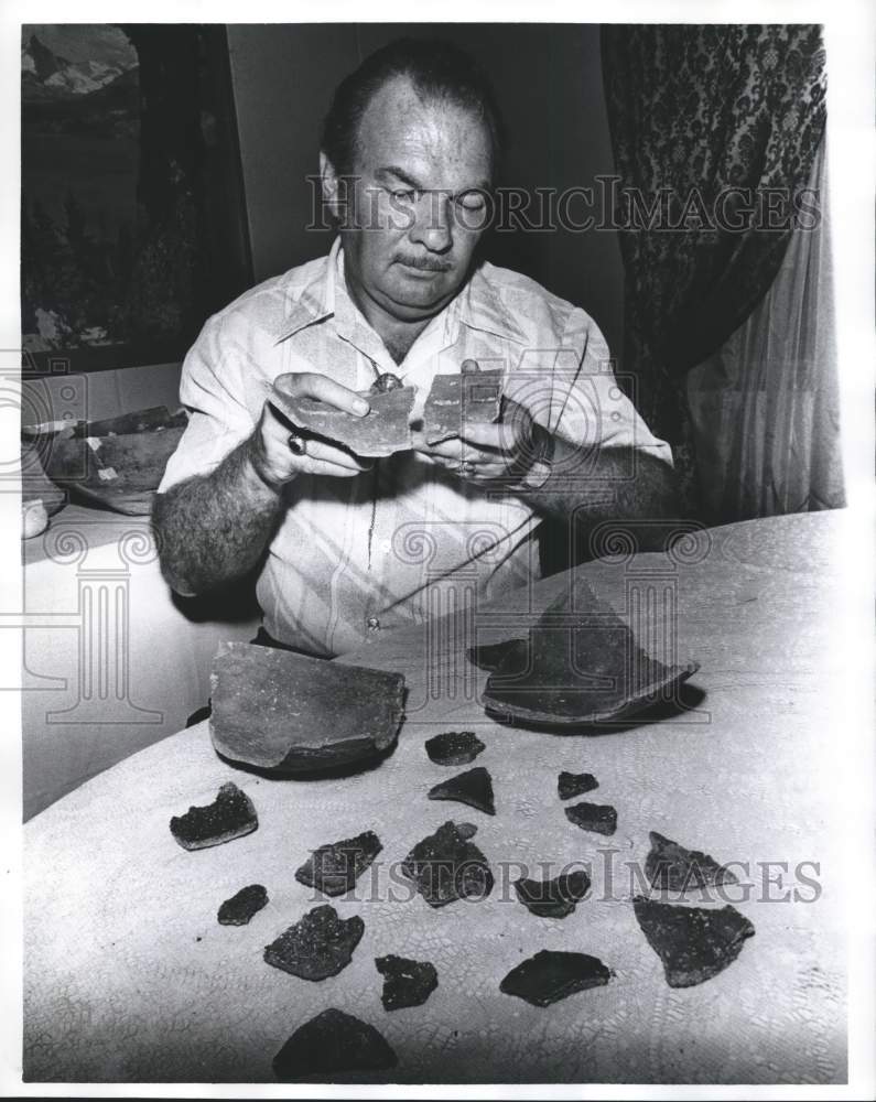 1978 Press Photo Man examines remains of pottery - abna18290 - Historic Images