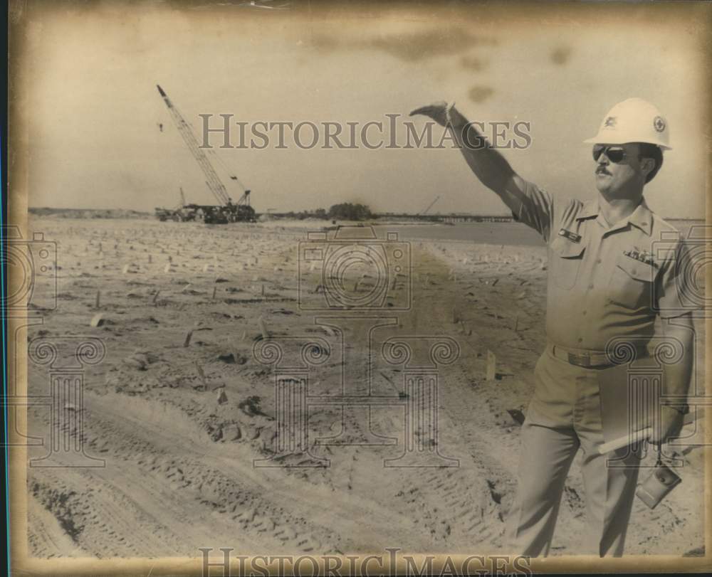 1989, Man Gesturing Near Construction at Naval Station Causeway - Historic Images