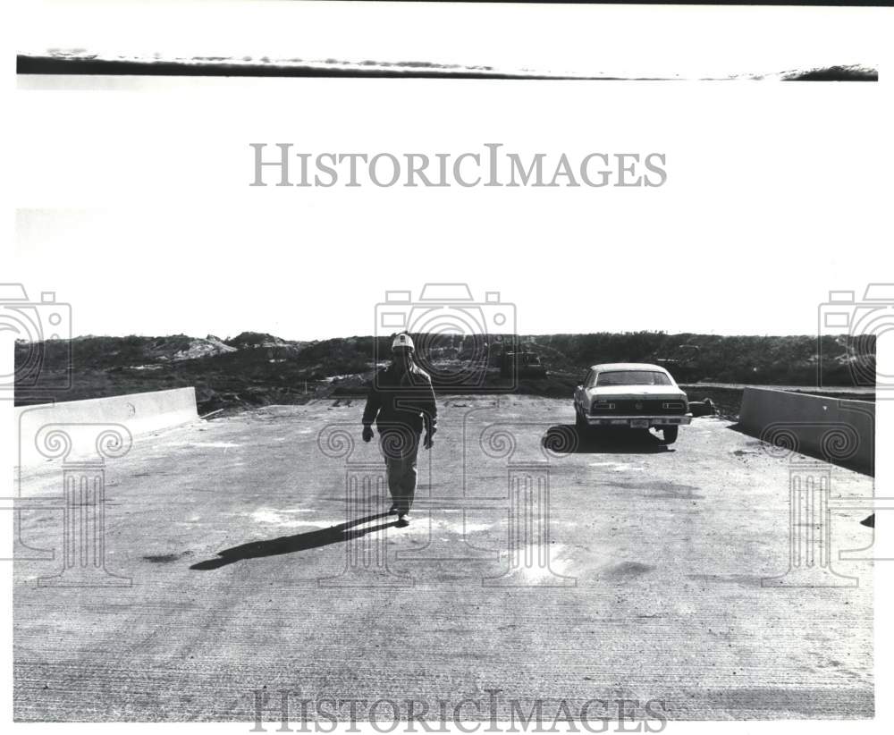 1989 Press Photo Man Walks Away from Car on Naval Station Causeway - abna18495 - Historic Images