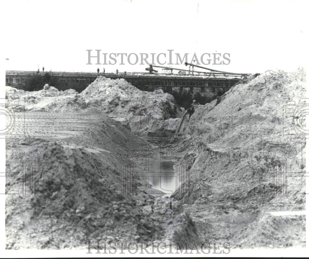 1989 Drainage Ditch Being Dug for Naval Station Causeway - Historic Images