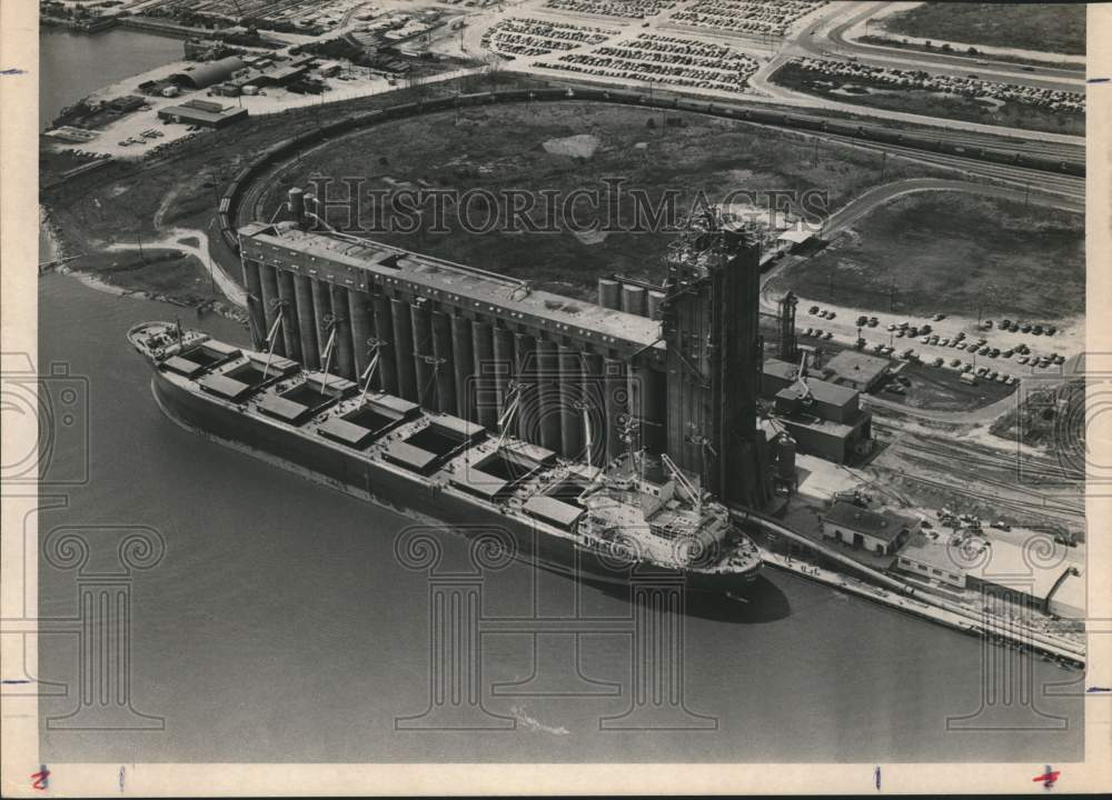 Press Photo Grain elevator at waterfront with ship, aerial view - abna18540 - Historic Images