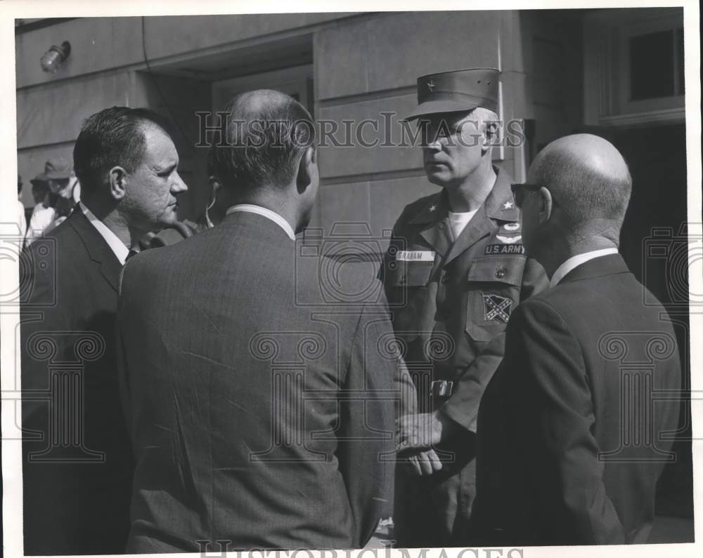 Press Photo Group of Men talking to Army Soldier - abna18680 - Historic Images