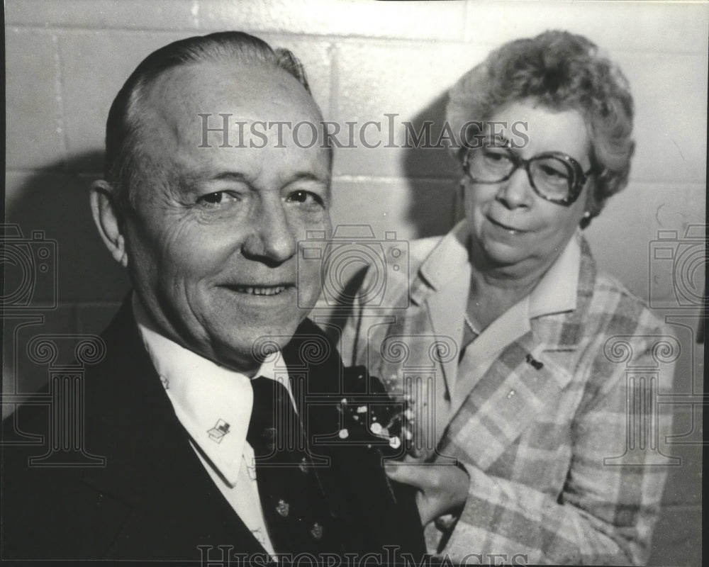 1982, Retiring B. Y. Williams receives Corsage from Mildred Romano - Historic Images