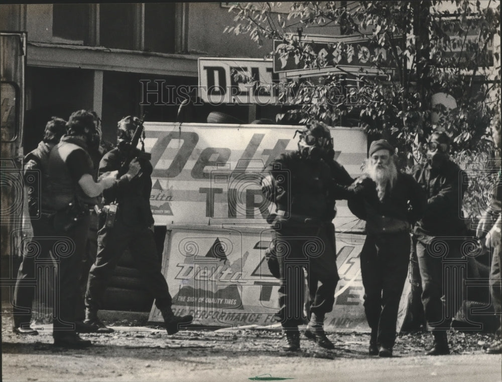 1983, J. H. Yessick led away by police - abna18981 - Historic Images