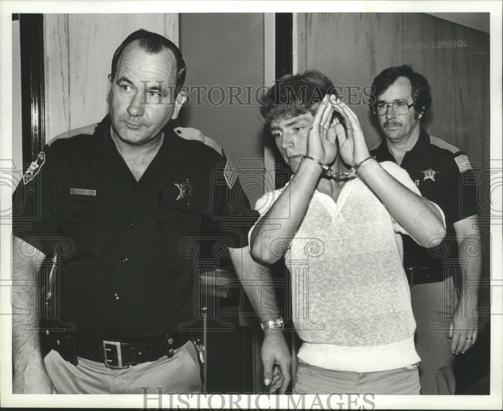 1981 Charles Edward Vanderford, Jr., Handcuffed, Escorted by Police - Historic Images