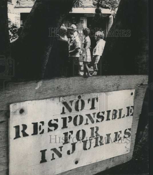 1973, Sign where bodies were found - 'Not responsible for injuries' - Historic Images