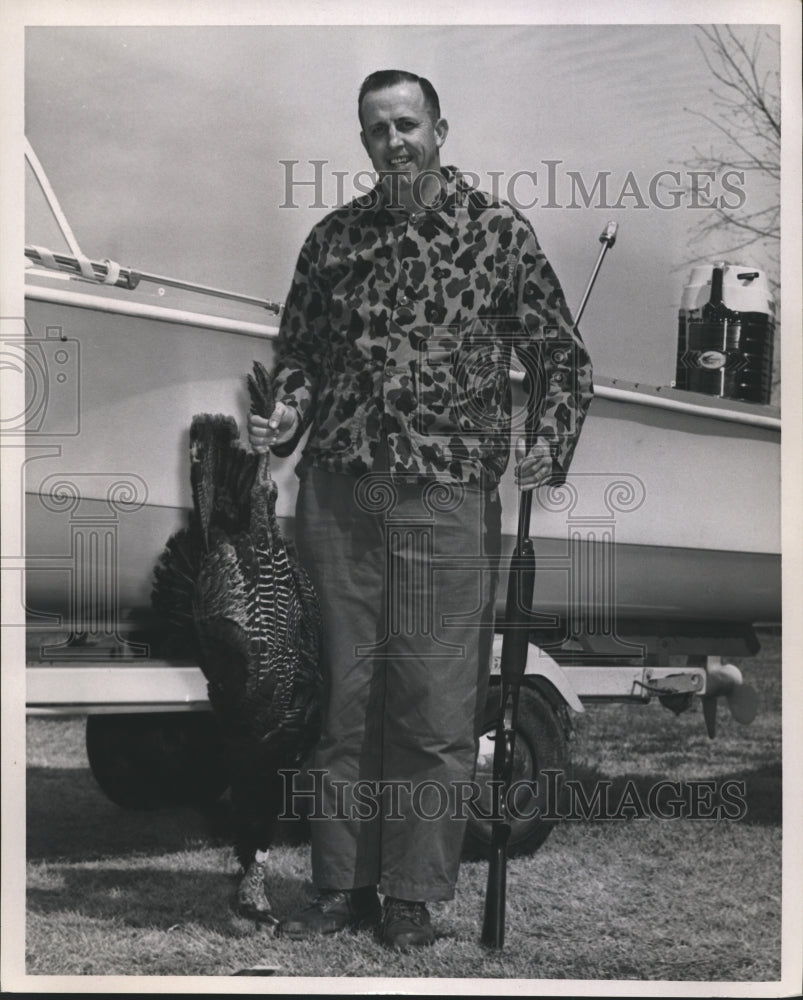 1962, W.C. Younger, Conservation Director, posing with dead turkey - Historic Images