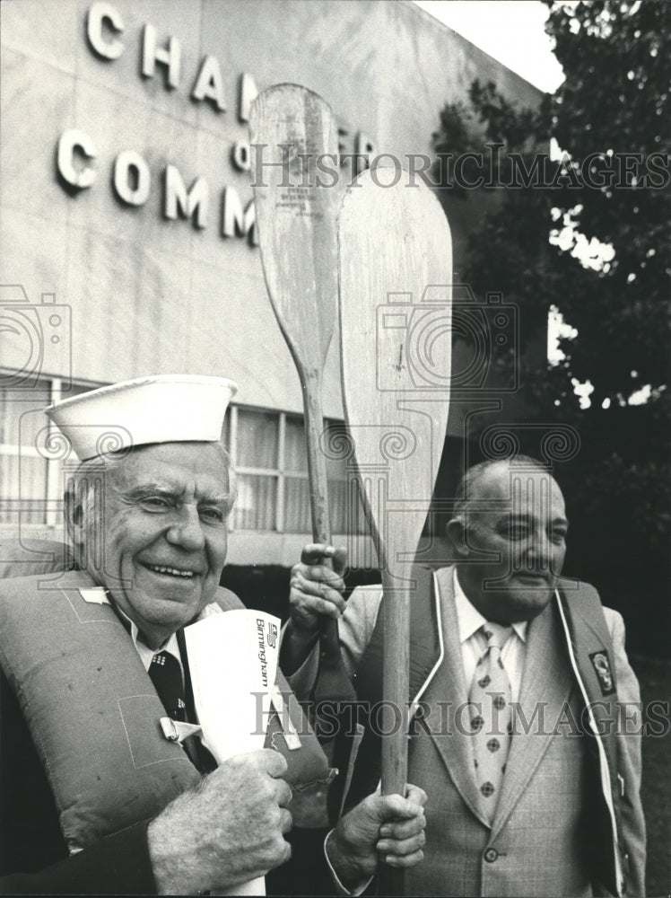 1976, W. H. Wurtele holds paddle at Birmingham Chamber of Commerce - Historic Images