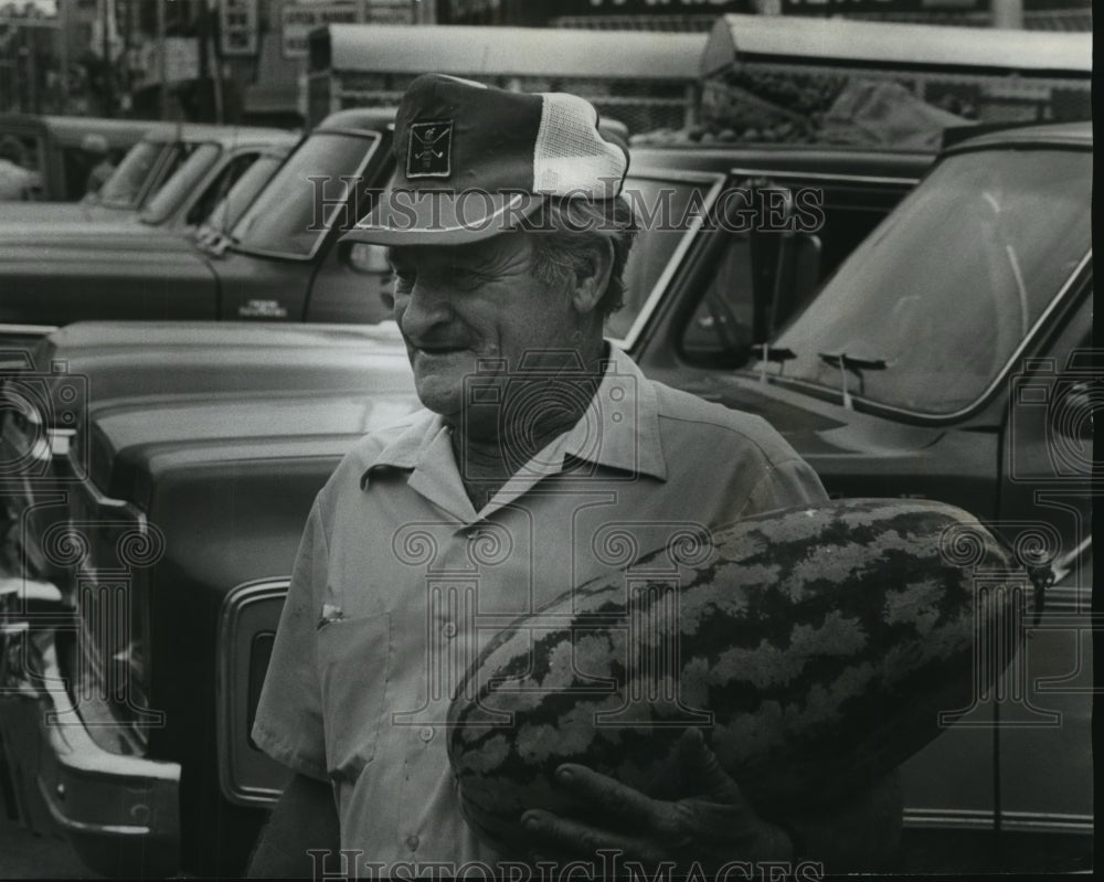 1978 Calvin Needham Carrying Watermelon, Birmingham, Alabama - Historic Images