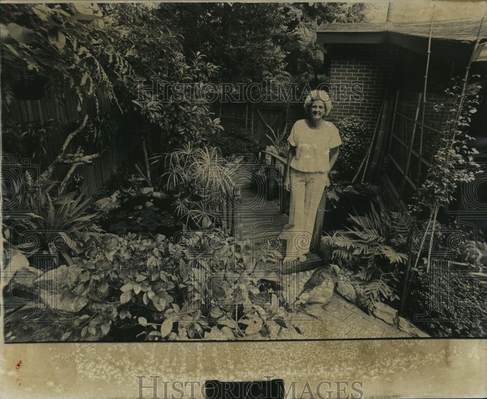 1978, Toni Renfro on the bridge in her own backyard crosses pond - Historic Images