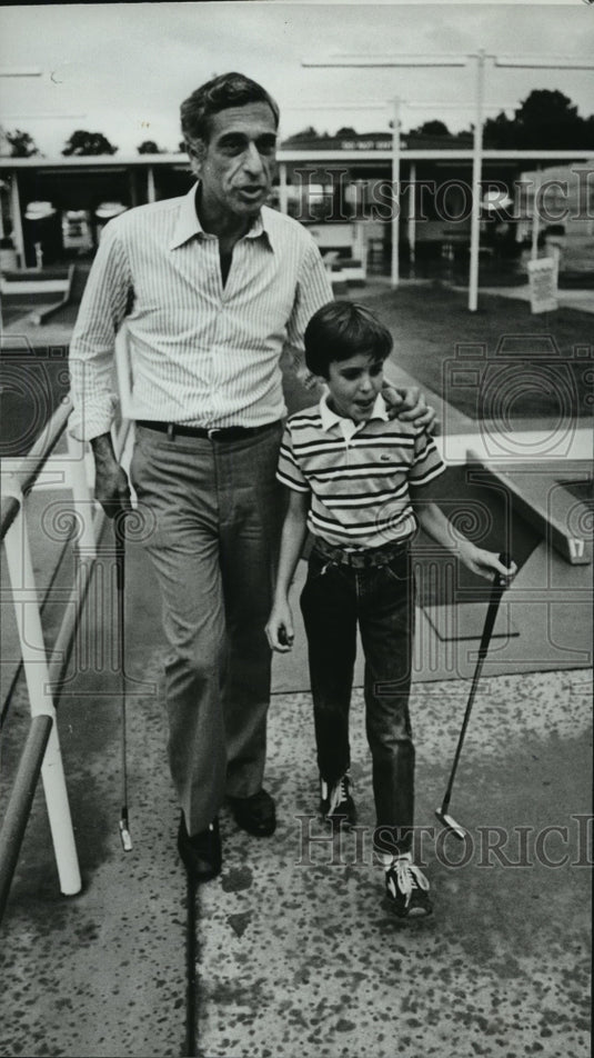 1980, Big Brothers program members Goodheart & Owen go mini golfing - Historic Images
