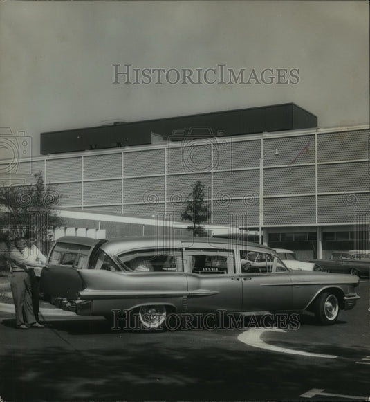 1961, Men open the back of a car at Birmingham Children's Hospital - Historic Images