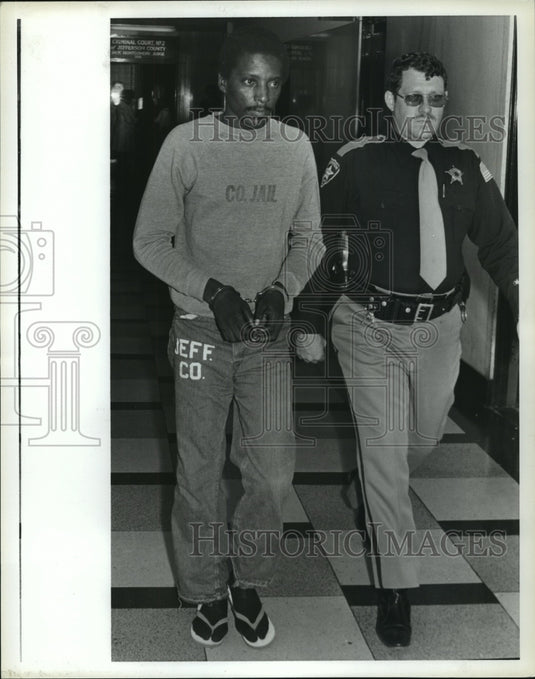1981 Charles Bennett is escorted by Bailiff Chris Galbaugh - Historic Images