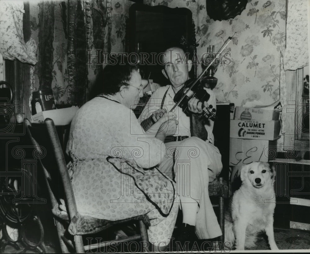 1966 Man Playing Violin with Woman and Dog - Andrew Bell-Historic Images