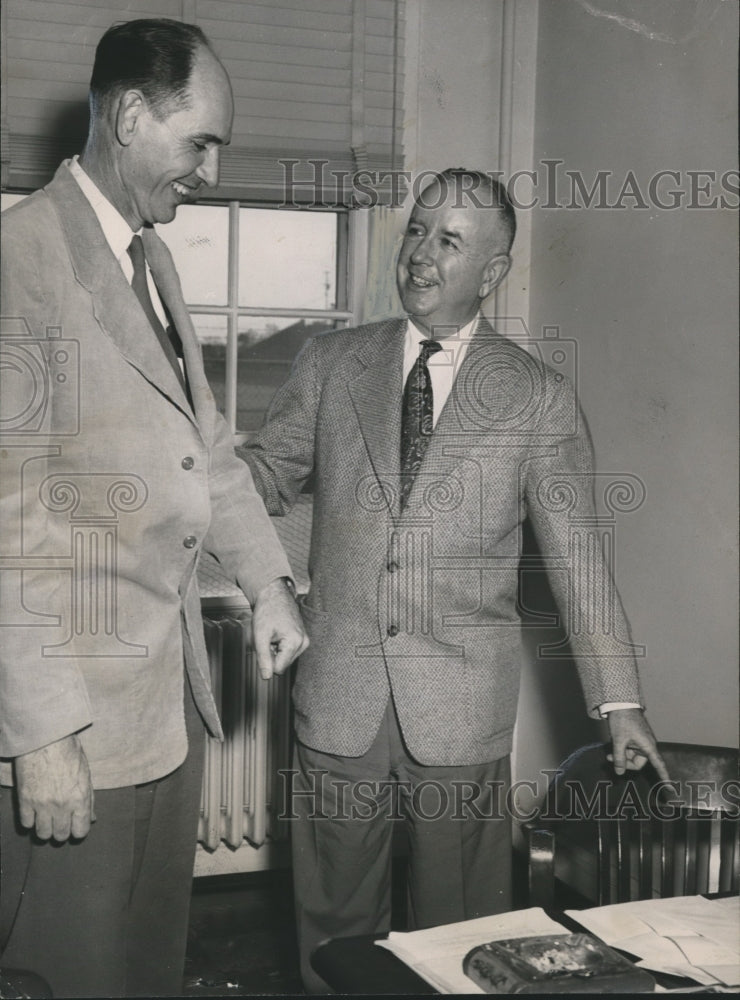 1951, Wilbur Hutsell inviting Jeff Beard to desk of Athletic Director - Historic Images