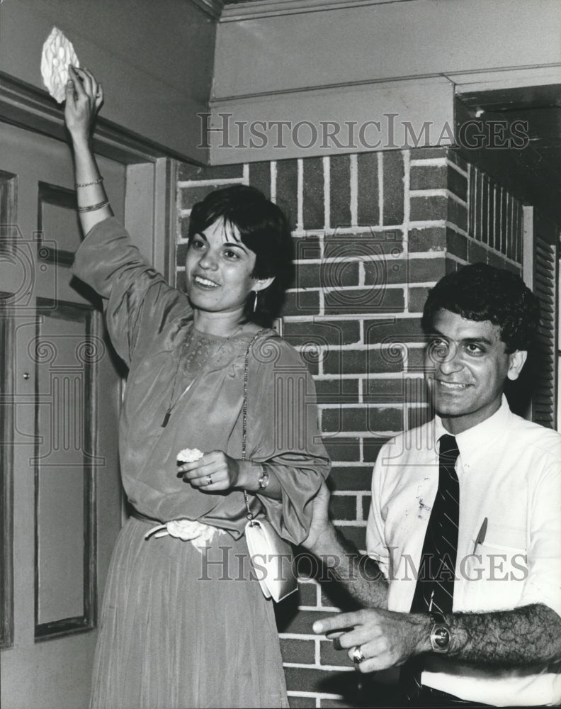 1982, Maggie Boohaker, putting bread dough above door, Alabama - Historic Images