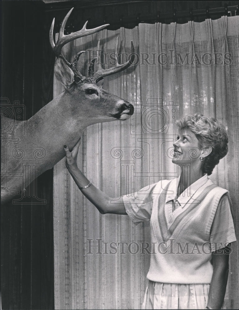 1986, Mary Buckeley with statute of deer - abna22106 - Historic Images