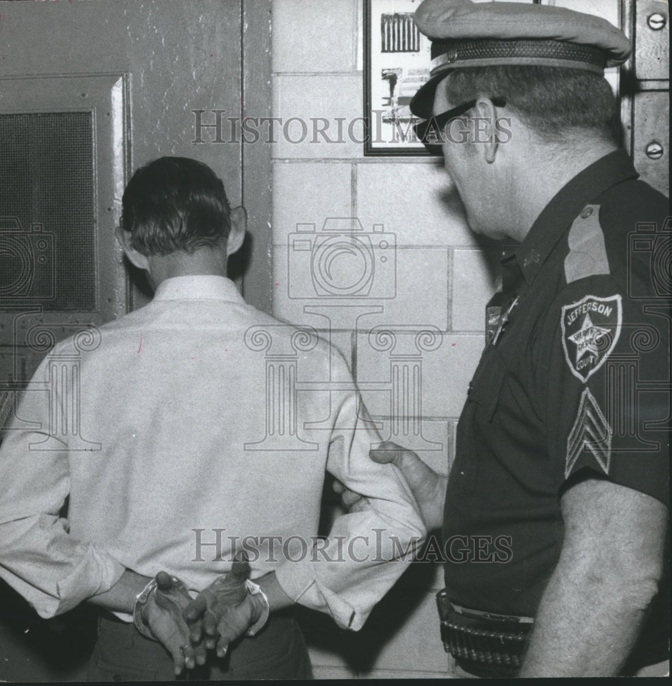 1969, Alabama-Jefferson County armed guard with handcuffed prisoner. - Historic Images