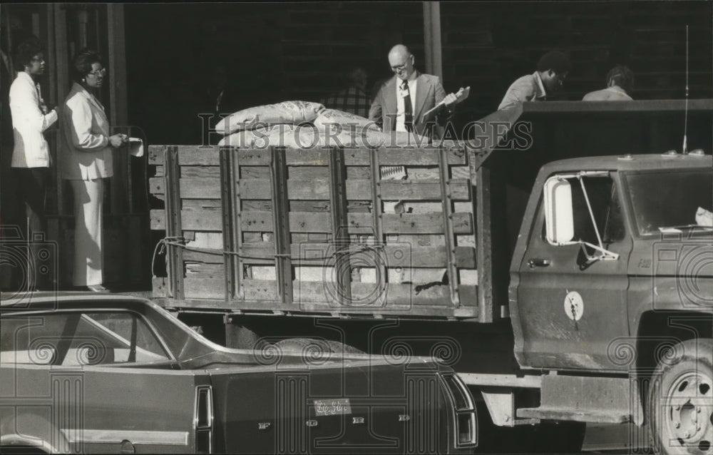 1980, Contaminated food being removed from Finley Warehouse, Alabama - Historic Images