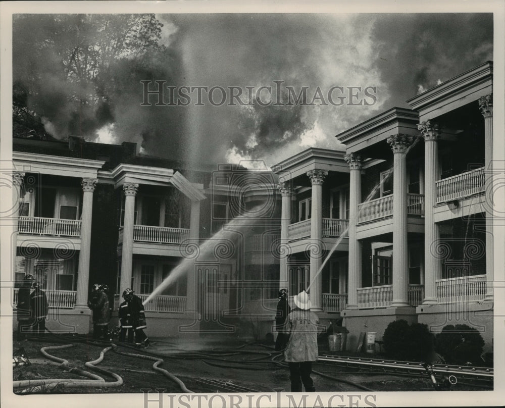 1985, Firemen pump water on the flames at Fairway Court Condominiums - Historic Images