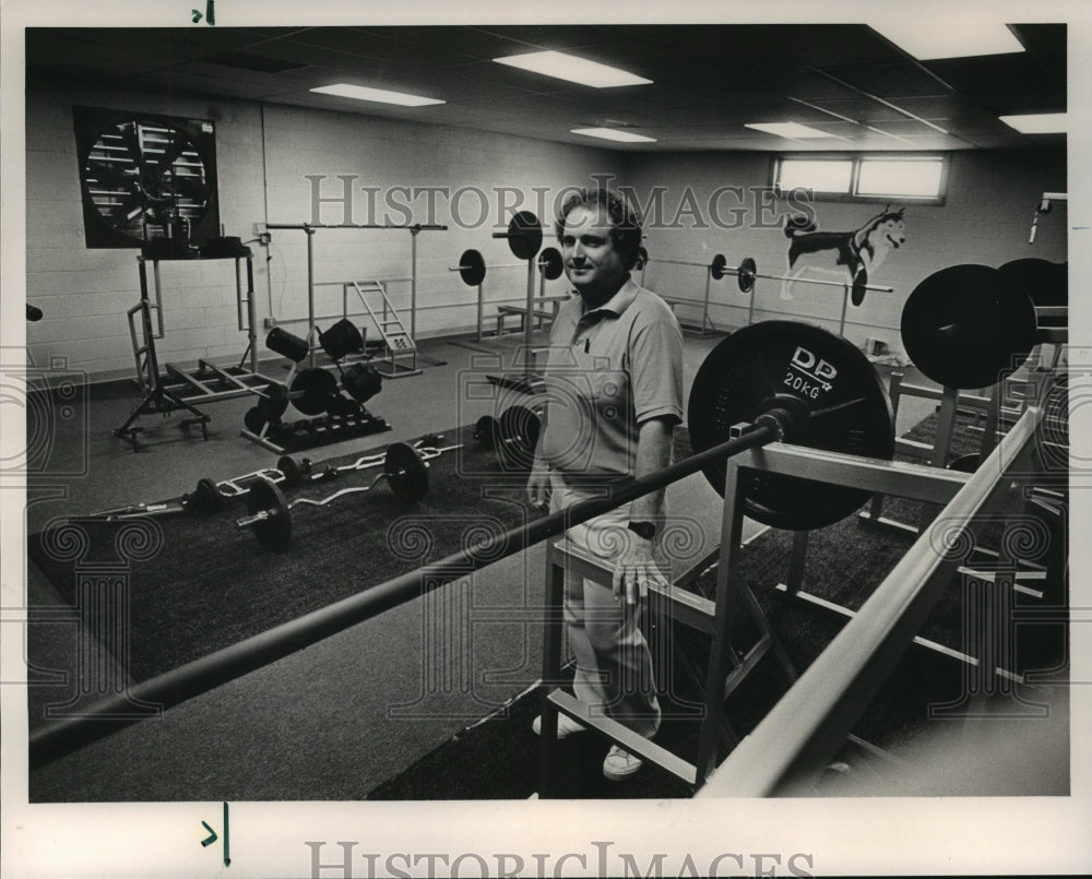 1986, Jewitt-Trussville Coach Jack Wood shows off fieldhouse - Historic Images