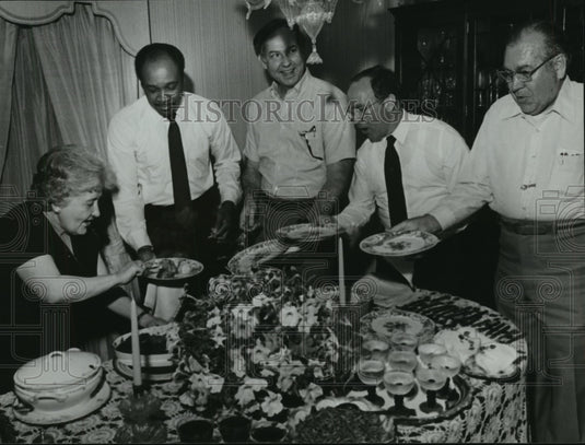 1981 Miss Nina dishes dinner to Birmingham City Council members - Historic Images