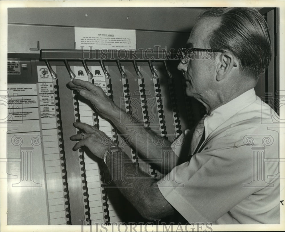 1980, William R. Jackson checks voting machines, Jefferson County - Historic Images