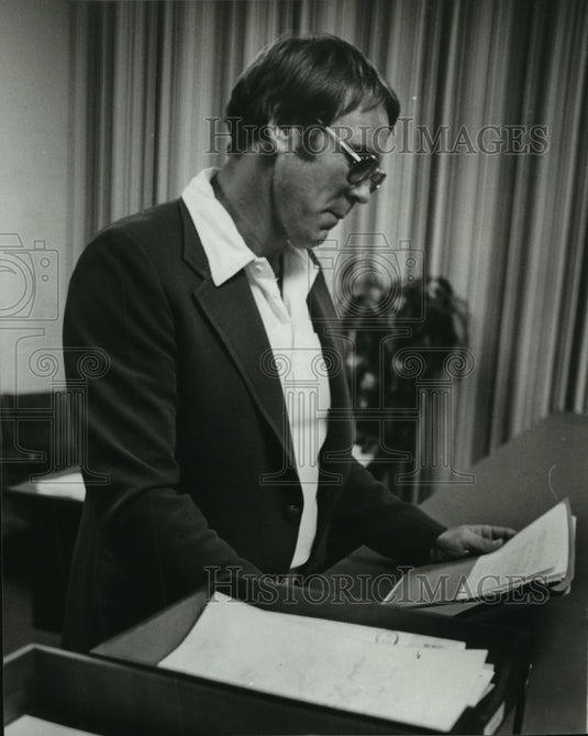 1980 Educator James E. Carroll tackles a principals paperwork - Historic Images