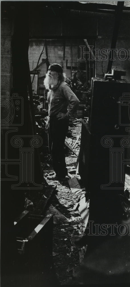 1980 Urban Hermit Joseph H. Yessick surveys condemned movie theater - Historic Images