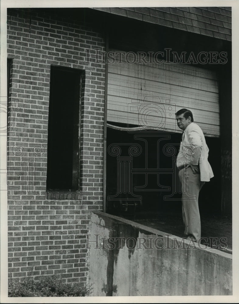 1986 Bill Hancock, owner, returns to Handy TV & Appliance after fire - Historic Images