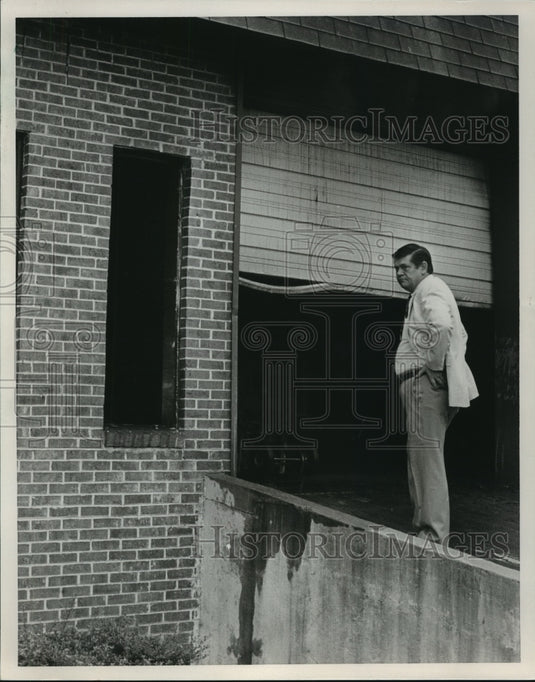 1986 Bill Hancock, owner, returns to Handy TV & Appliance after fire - Historic Images