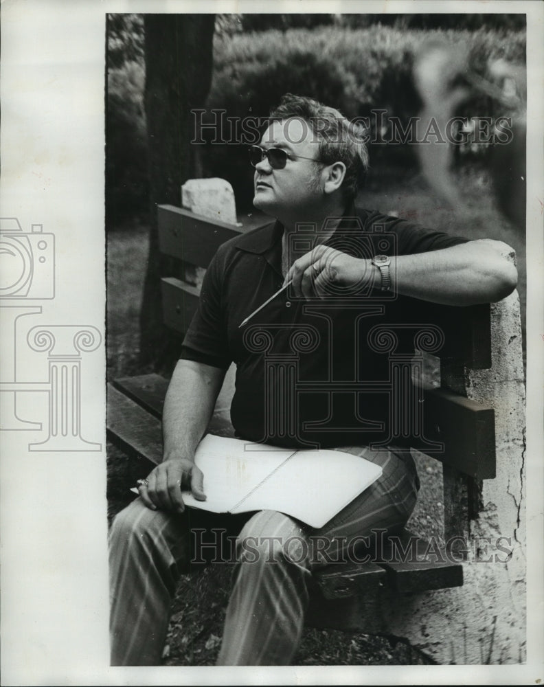 1973, Birmingham police officer Capt. Wallace Chilcoat on park bench - Historic Images