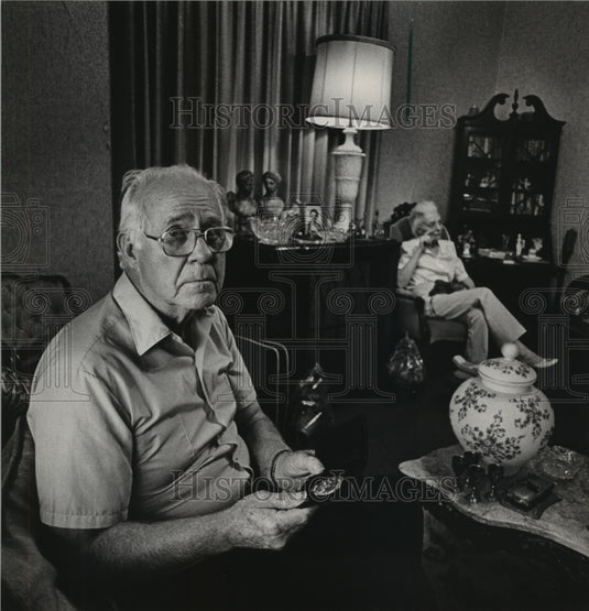 1984 Retired officer Howell Carroll holds "retired" badge, Alabama - Historic Images