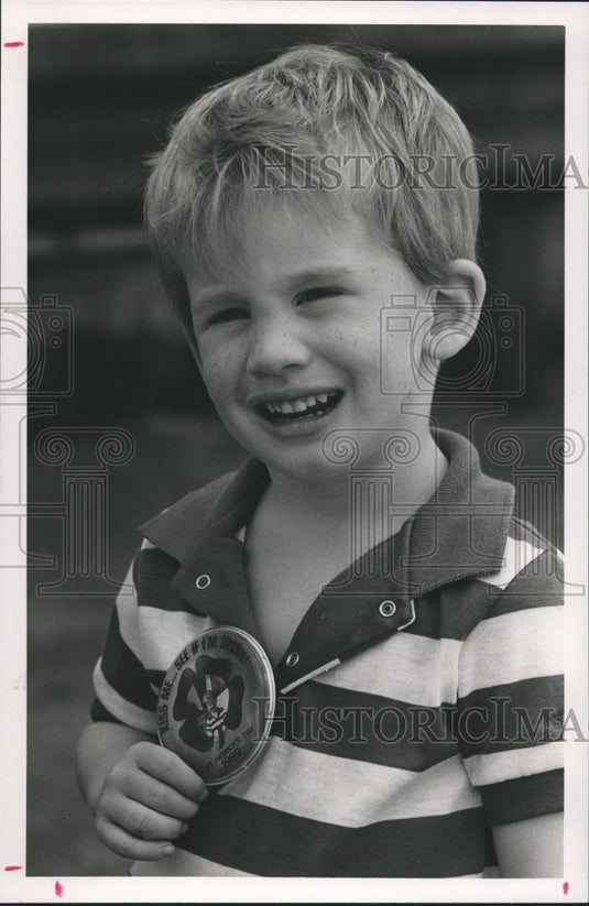 1989 Josh Tice, age 3, on Saint Patrick's' Day with Button - Historic Images